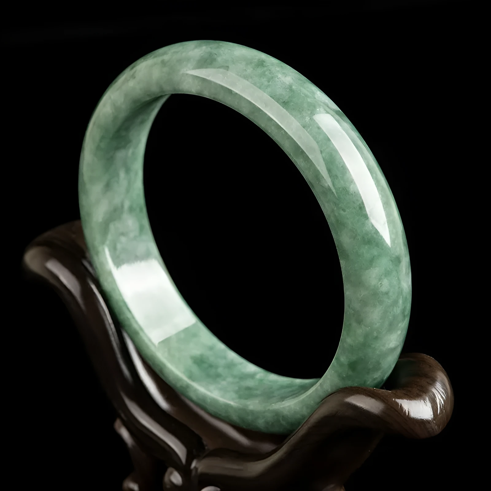 Natural deep pea green jade bangle bracelet for women on a gift box.
