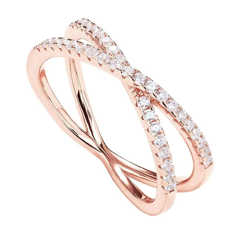 Silver cross ring with diamond-embedded half circle wide band in rose colour finish on white background
