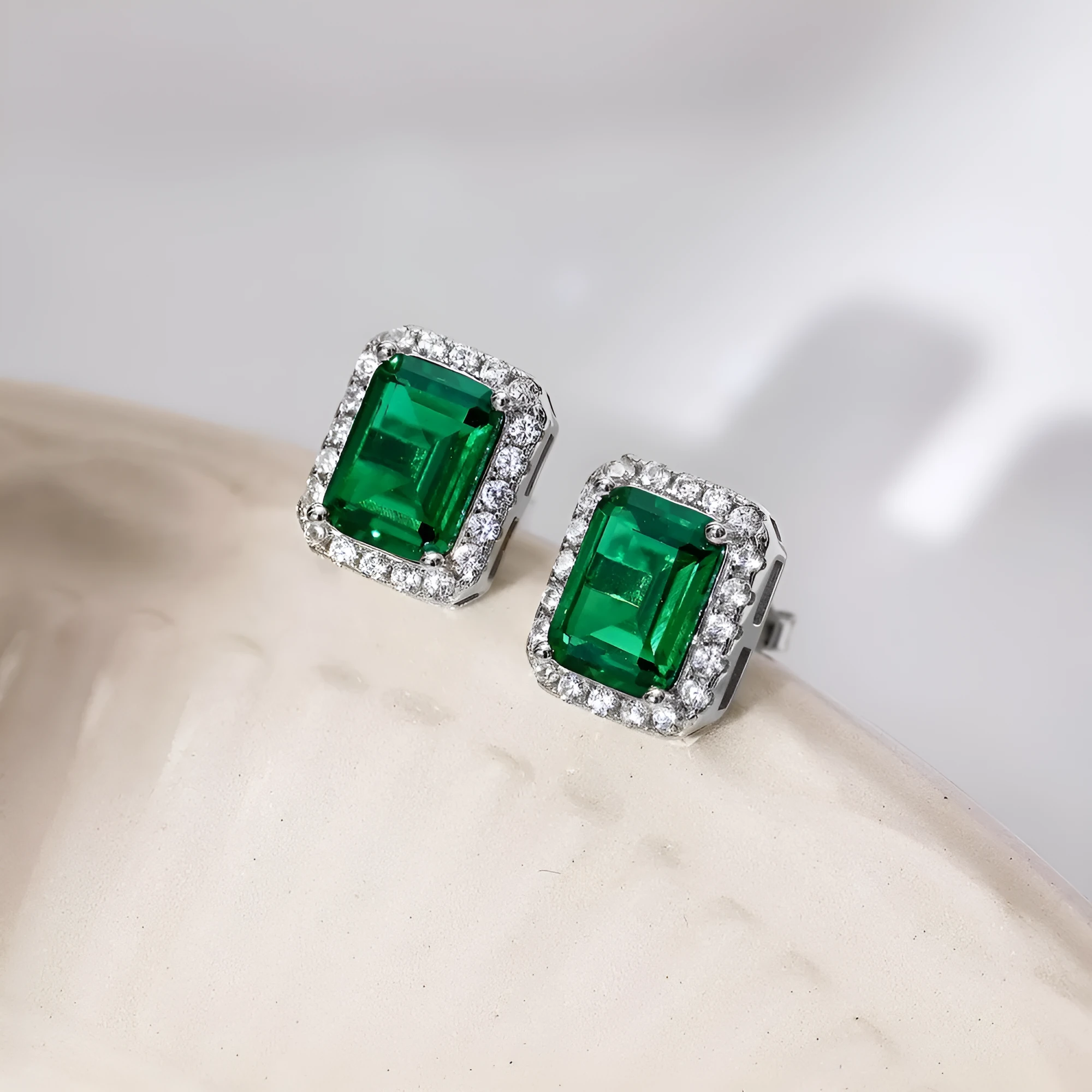 Diamond and emerald symmetry stud earrings in platinum 925 silver 8.5 x 10.5mm