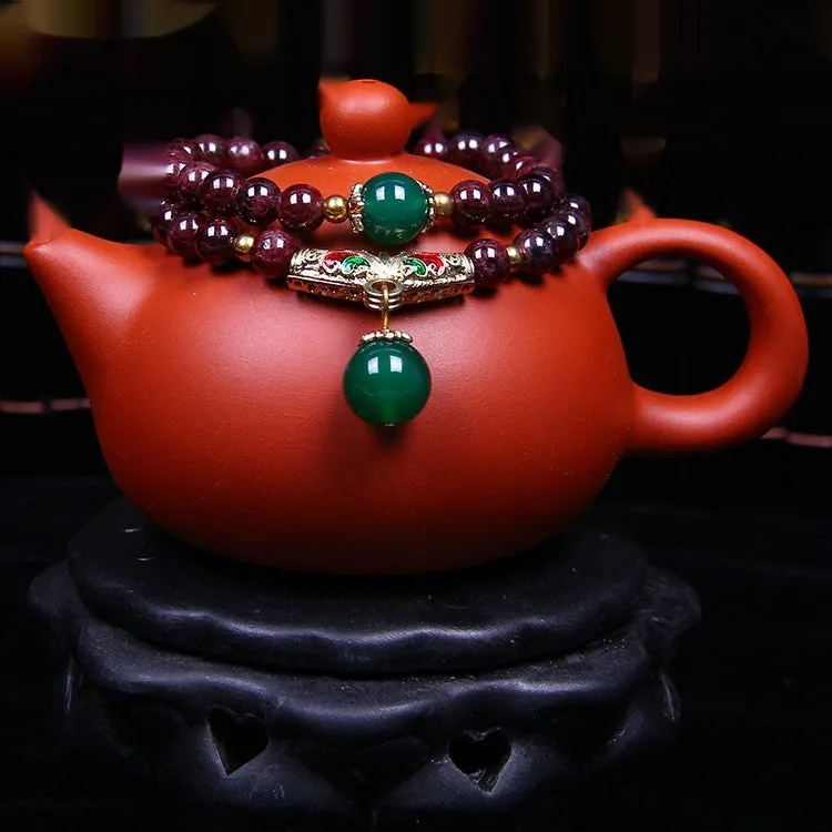 Natural garnet bracelet with 7mm beads, golden toad charm and adjustable double-ring clasp