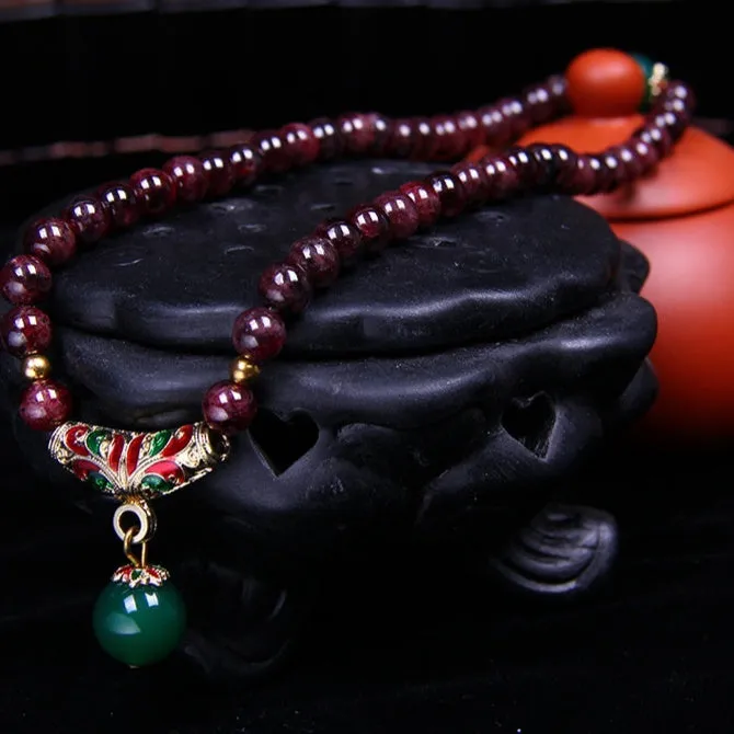 Natural garnet bracelet with 7mm beads, golden toad charm and adjustable double-ring clasp