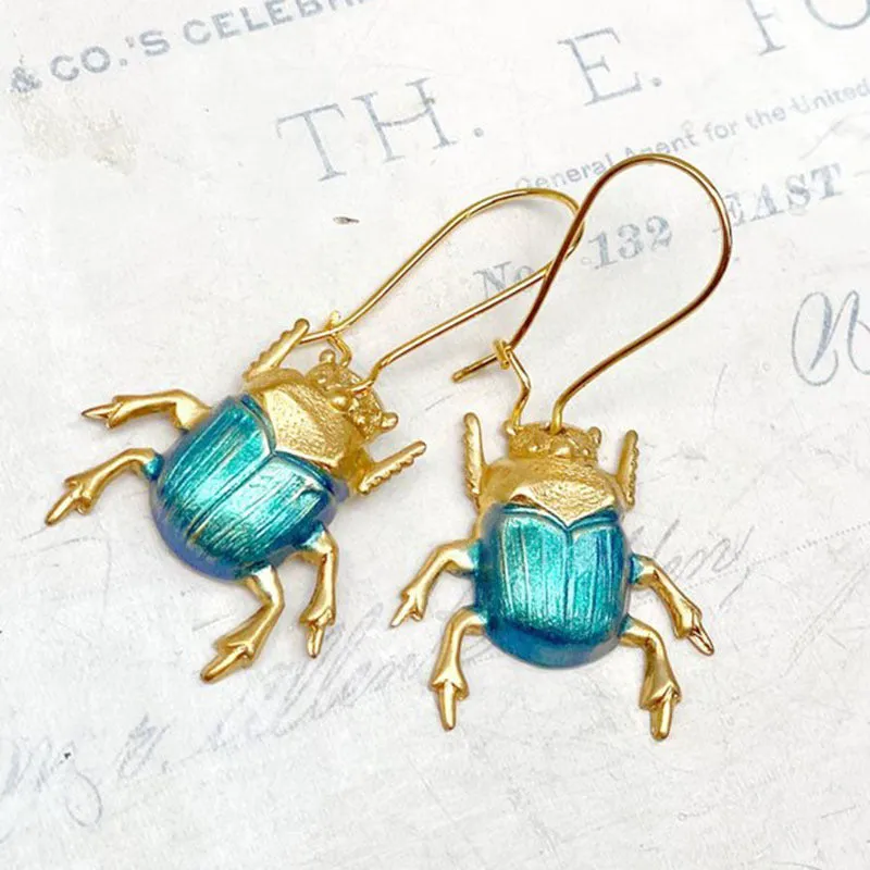 Retro beetle earrings for women, gold metal with electroplated blue finish, creative insect design