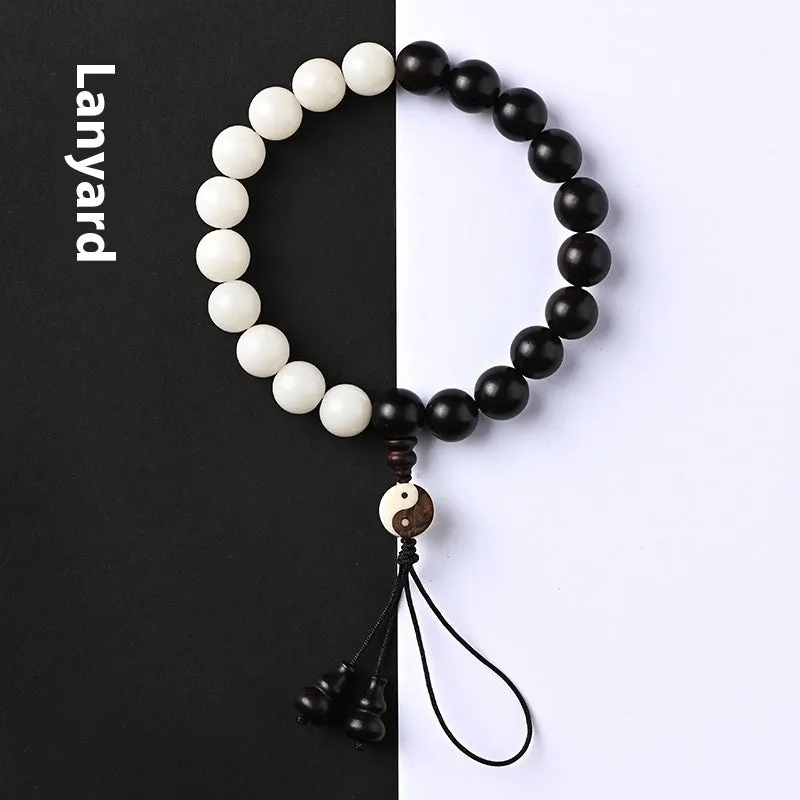 White and blackwood bead bracelet in eight-diagram pattern with natural bodhi seeds