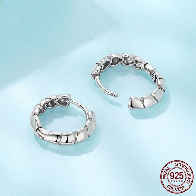 S925 sterling silver loving heart splicing ear clip with polished finish on white background