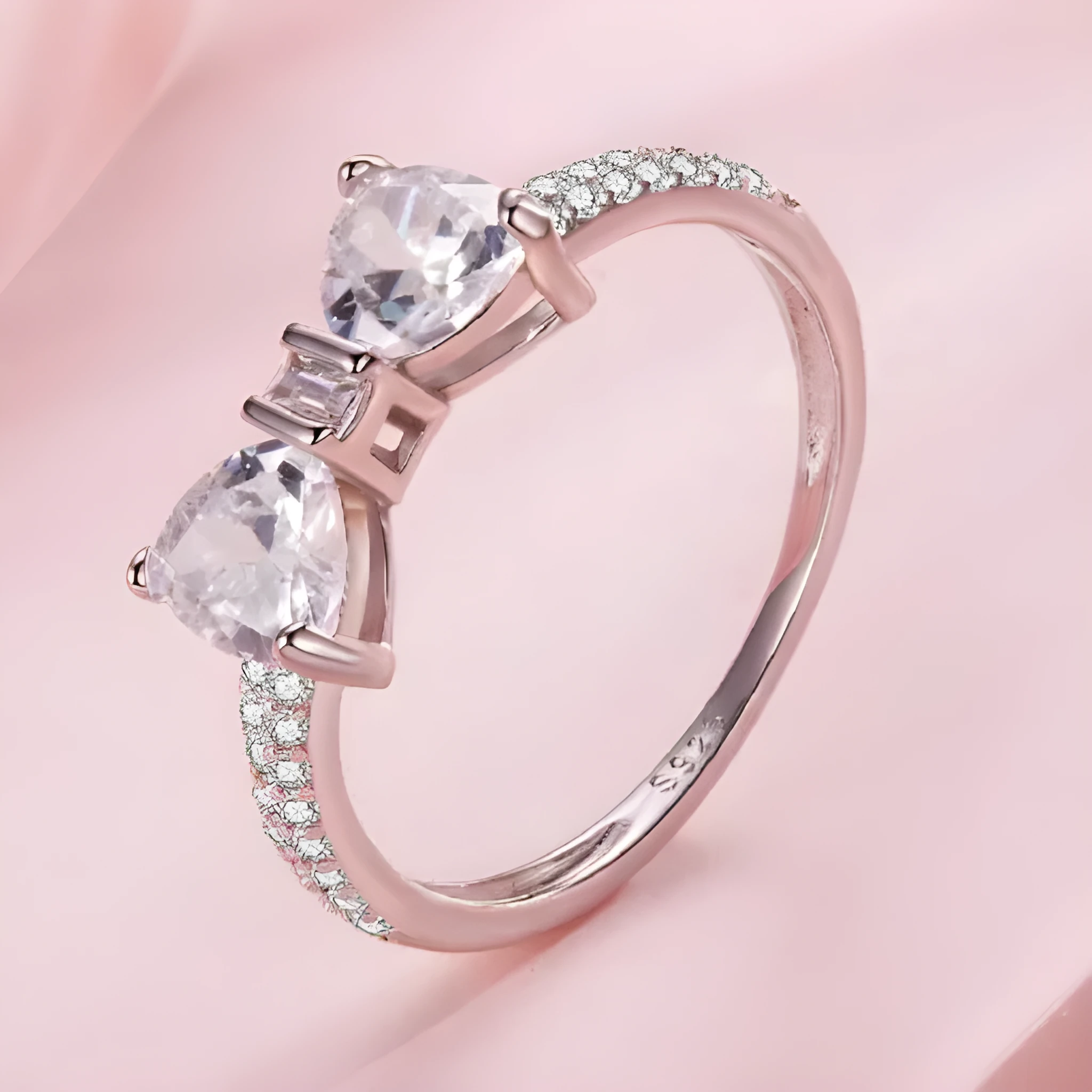 Sterling silver bow ring with zircon stone, available in sizes 6, 7, and 8, electroplated finish