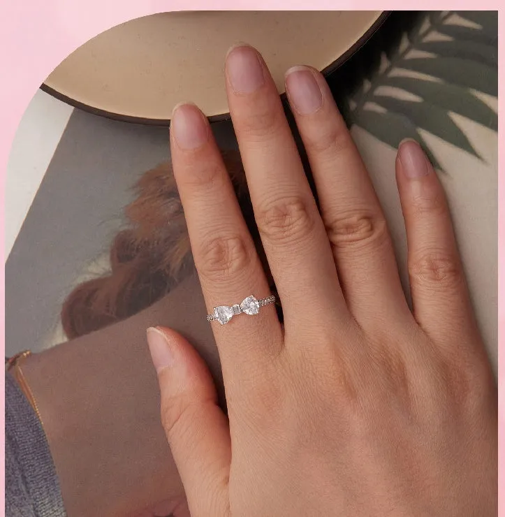 Sterling silver bow ring with zircon stone, available in sizes 6, 7, and 8, electroplated finish