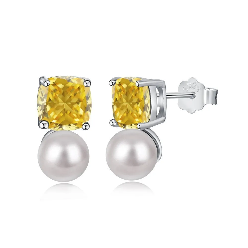 Sterling silver earrings with diamond-shaped zirconium inlay and pearl centre
