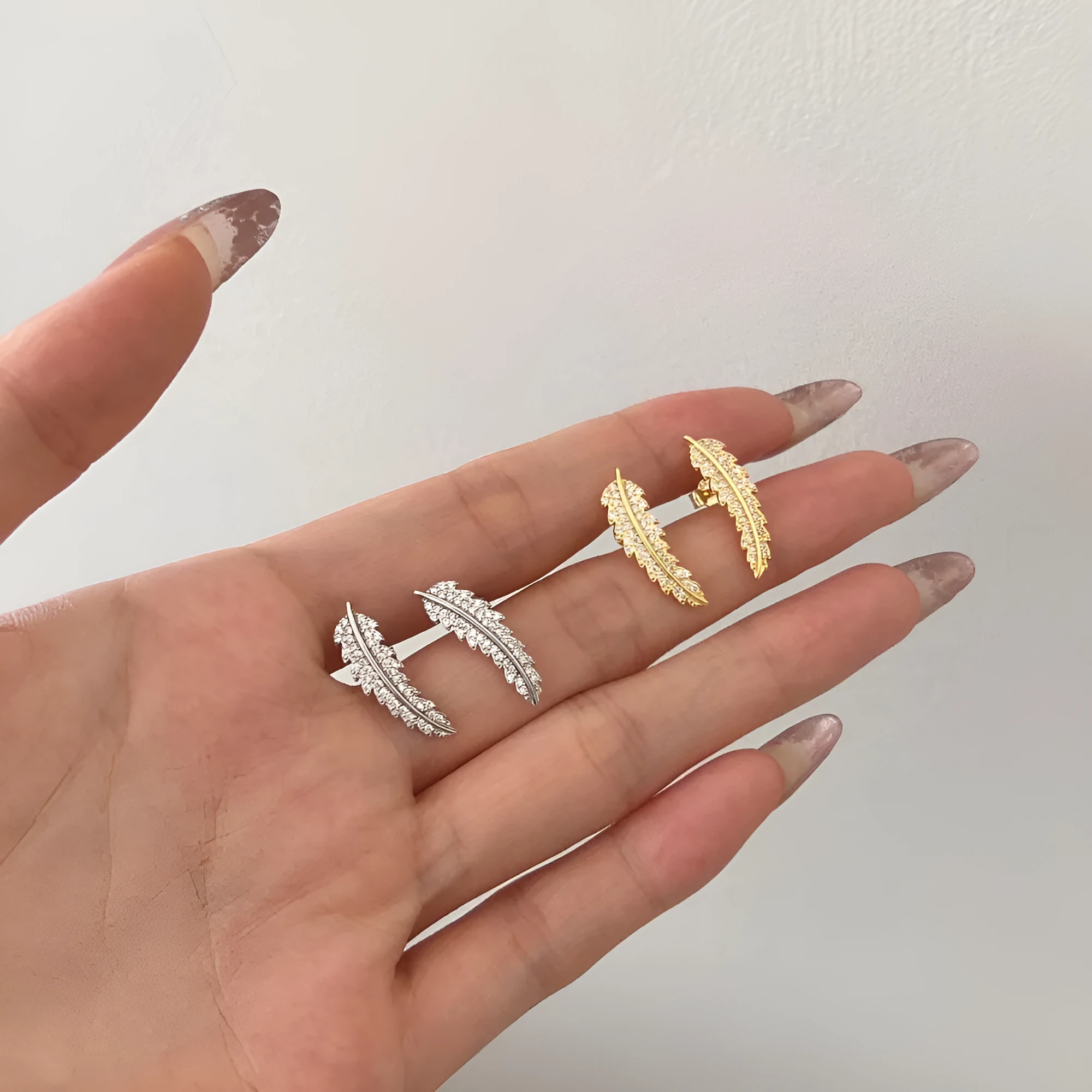 Leaf-shaped zircon inlaid S925 sterling silver stud earrings for women in white gold finish