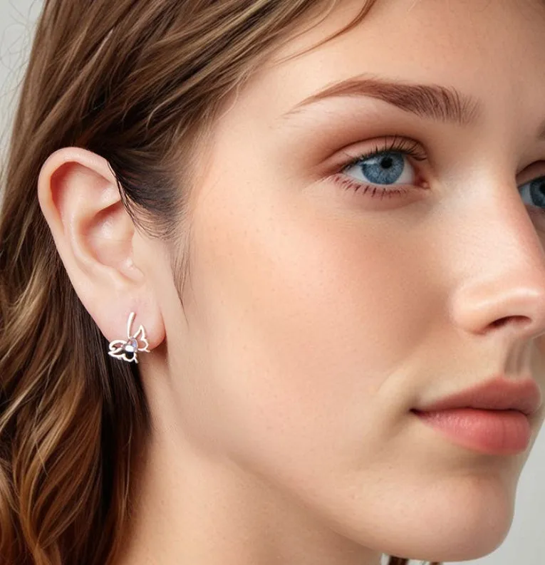 925 silver butterfly stud earrings with moonstone inlay on a white background