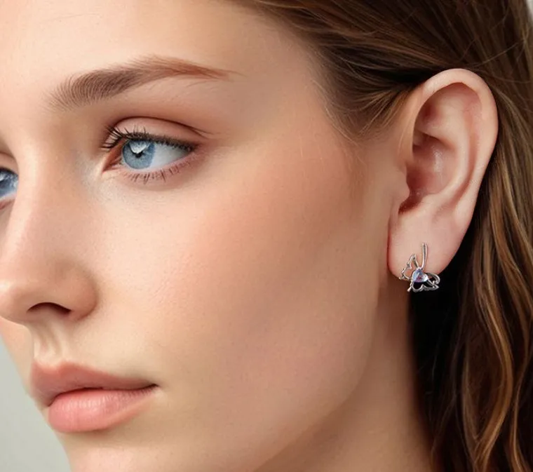 925 silver butterfly stud earrings with moonstone inlay on a white background