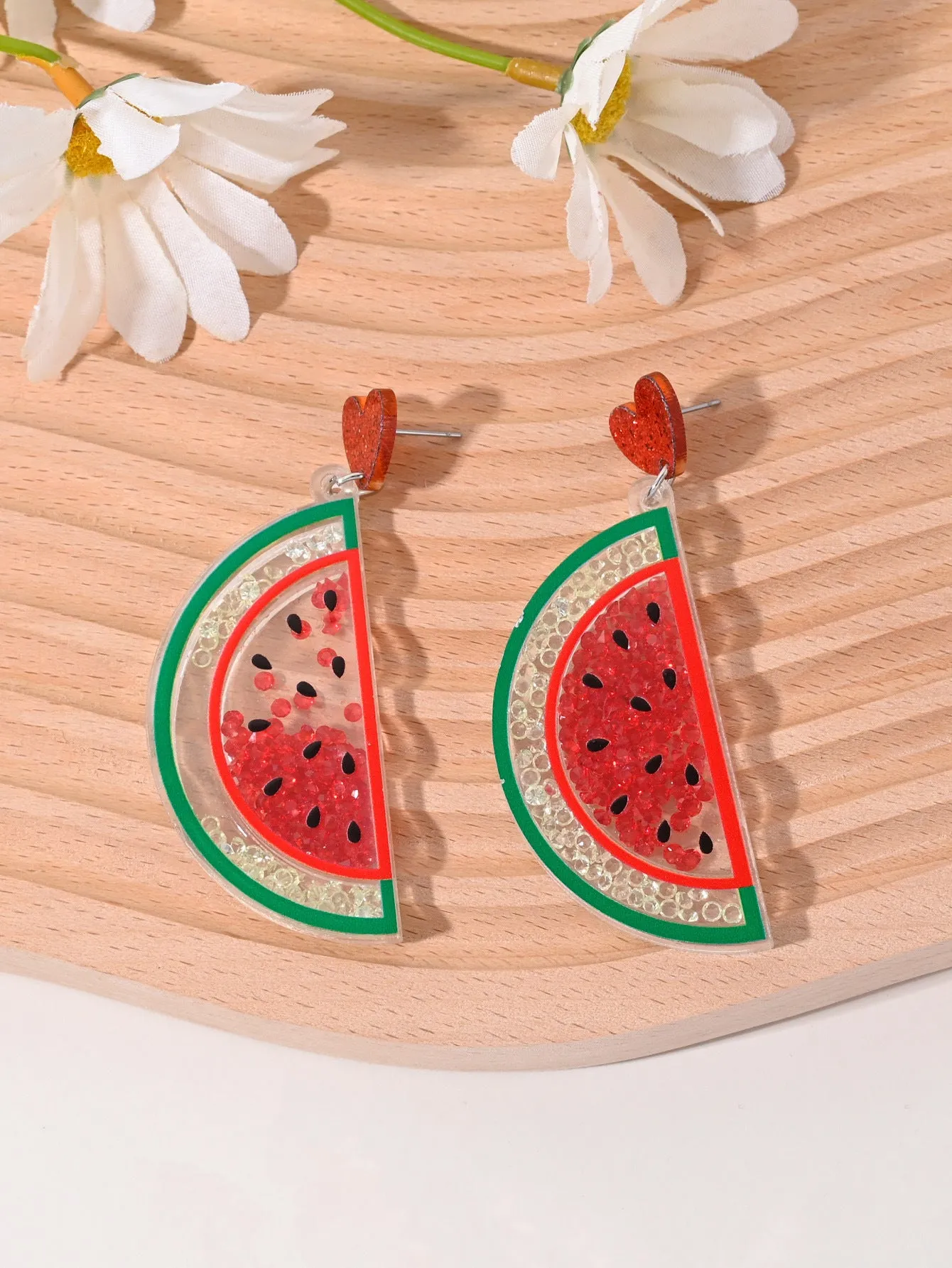 Colourful acrylic earrings with realistic fruit and dessert charms including cherry, strawberry, and ice cream.