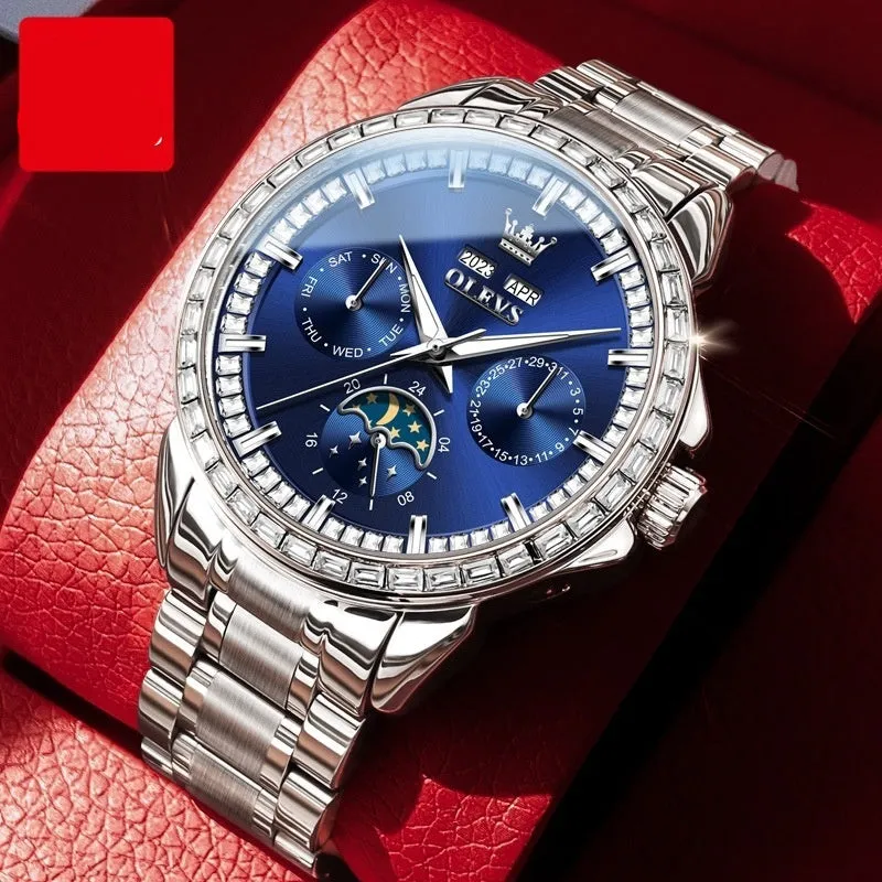 Men's stainless steel automatic mechanical watch with a blue dial and butterfly clasp on a wrist.