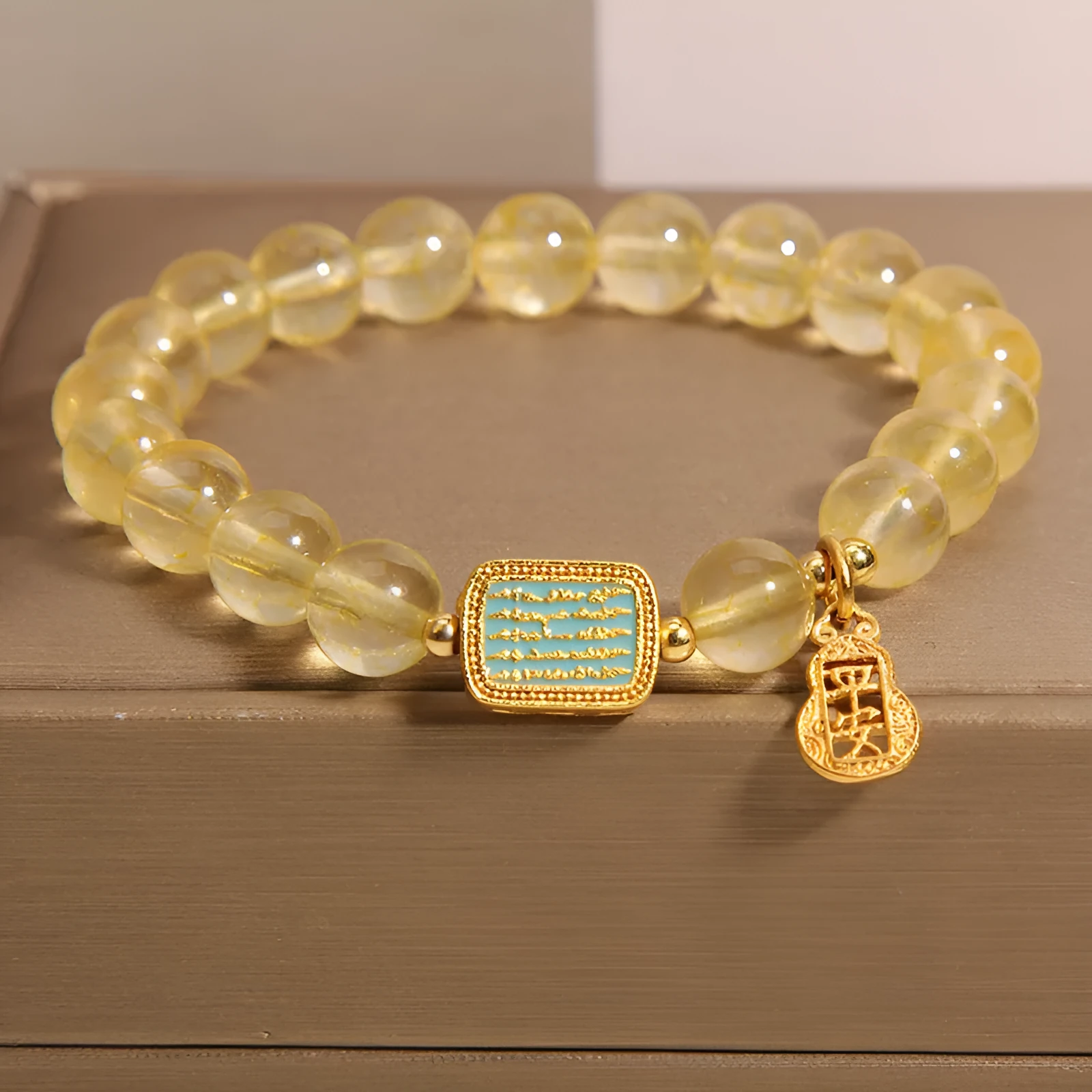Yellow citrine crystal women's bracelet with rhinestone detailing on wrist