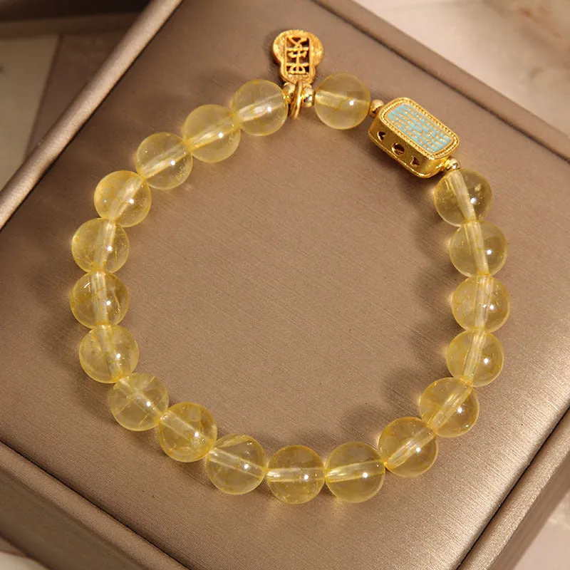 Yellow citrine crystal women's bracelet with rhinestone detailing on wrist