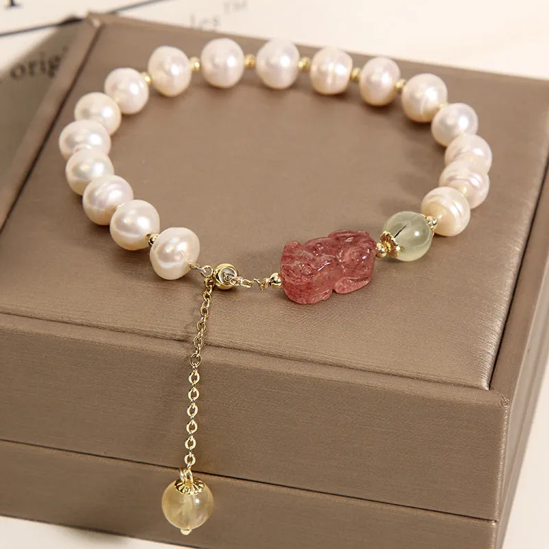 Women's multi-layer crystal bracelet with natural garnet, strawberry quartz pendants, and jinsi jade beads in assorted colours.