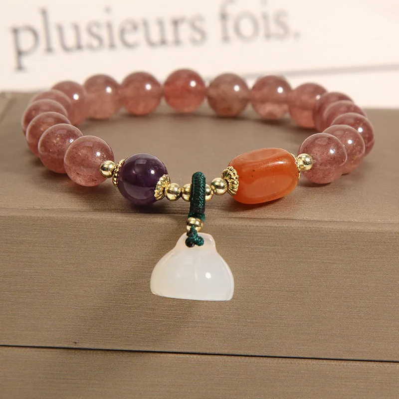Women's multi-layer crystal bracelet with natural garnet, strawberry quartz pendants, and jinsi jade beads in assorted colours.