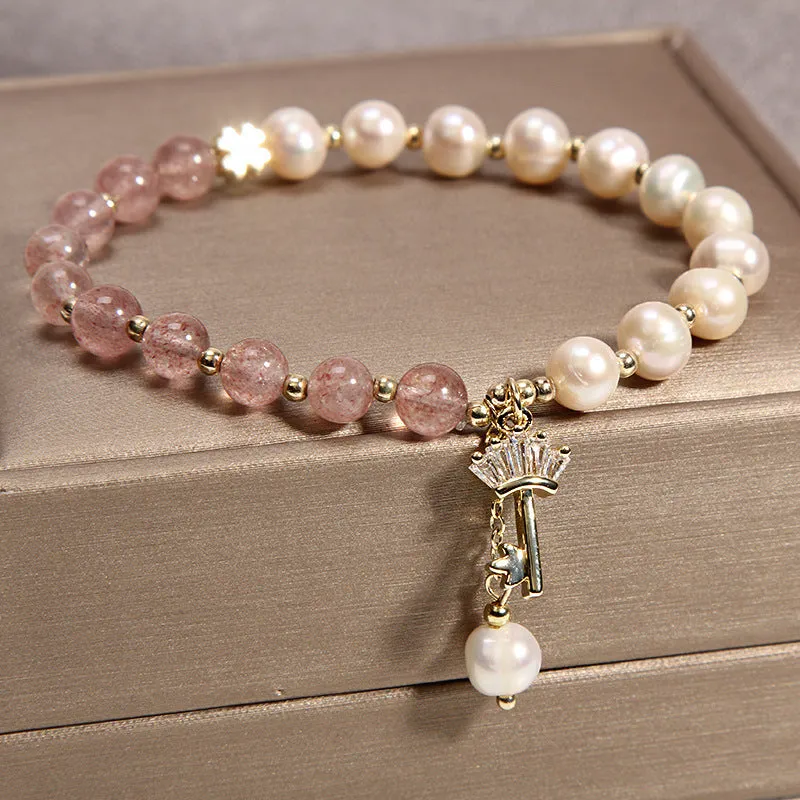 Women's multi-layer crystal bracelet with natural garnet, strawberry quartz pendants, and jinsi jade beads in assorted colours.