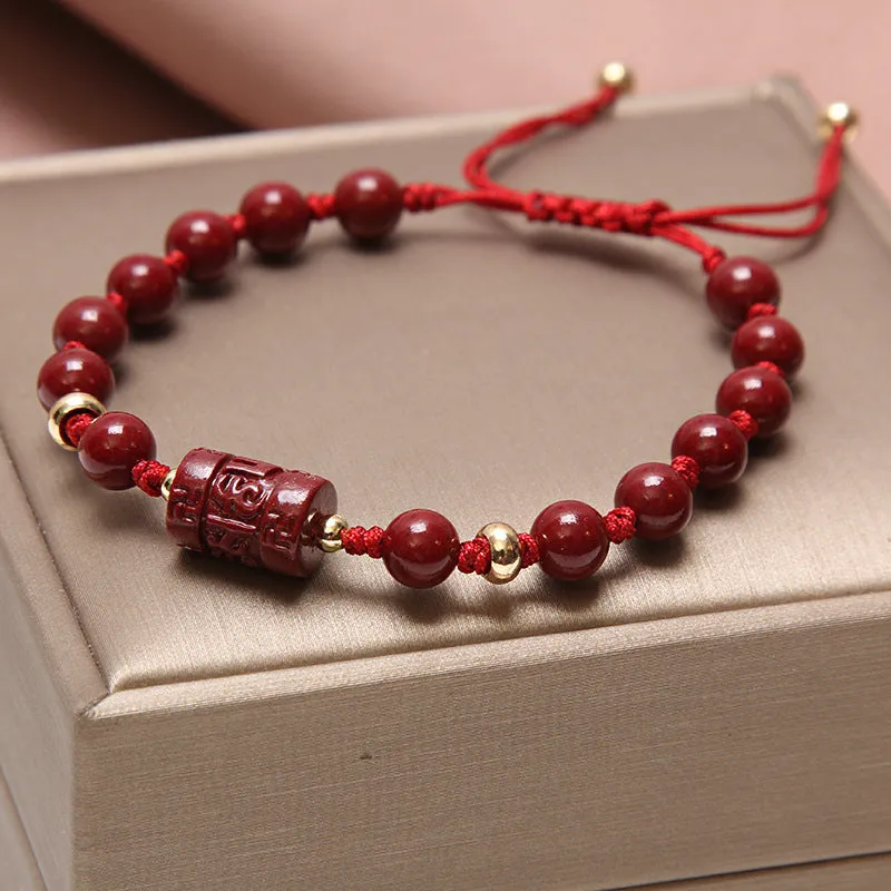 Women's multi-layer crystal bracelet with natural garnet, strawberry quartz pendants, and jinsi jade beads in assorted colours.