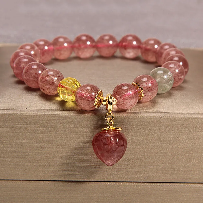 Women's multi-layer crystal bracelet with natural garnet, strawberry quartz pendants, and jinsi jade beads in assorted colours.