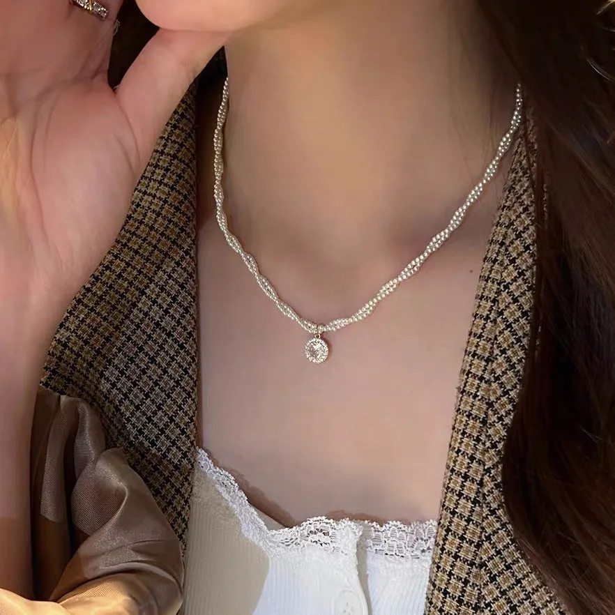 Unisex magnetic sweater necklace with mother pearl shellfish pendant and organic glass setting on electroplated chain, available in multiple colours