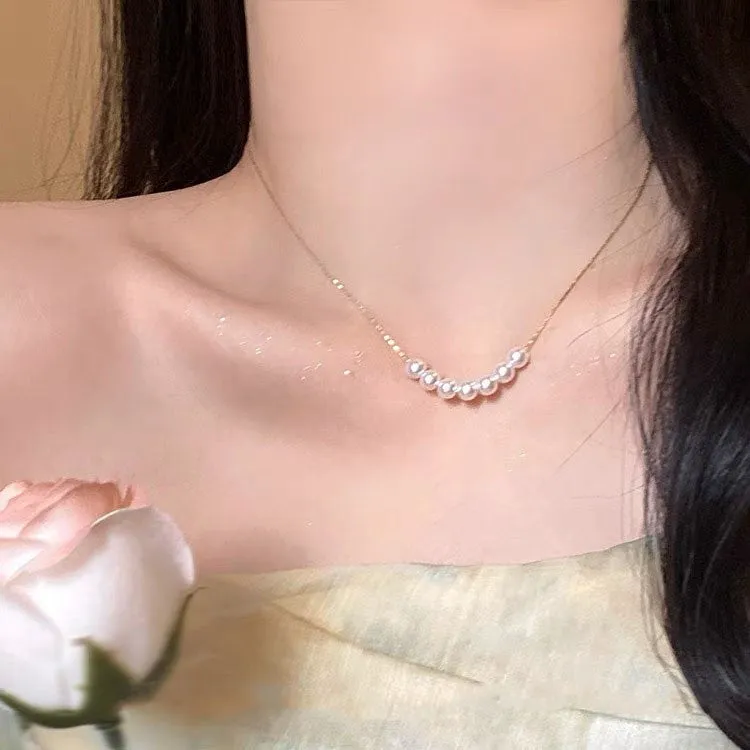 Unisex magnetic sweater necklace with mother pearl shellfish pendant and organic glass setting on electroplated chain, available in multiple colours