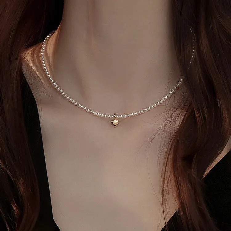 Unisex magnetic sweater necklace with mother pearl shellfish pendant and organic glass setting on electroplated chain, available in multiple colours