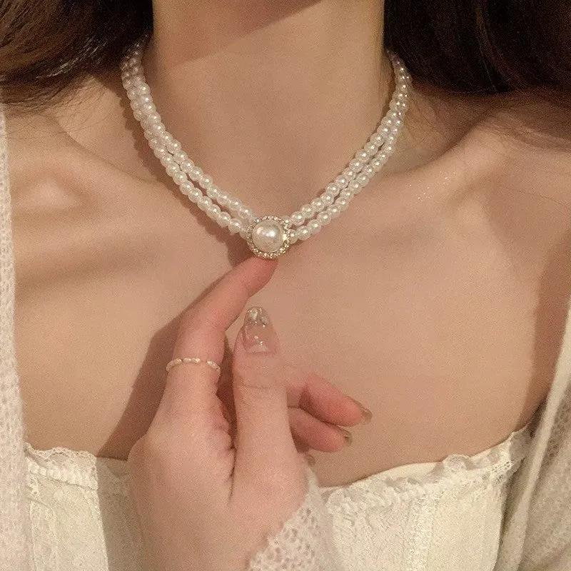 Unisex magnetic sweater necklace with mother pearl shellfish pendant and organic glass setting on electroplated chain, available in multiple colours