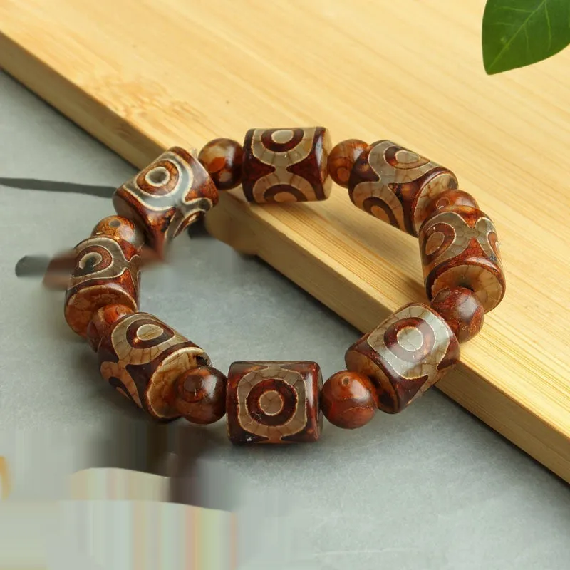Distressed agate Tibet beads bracelet with three eye dzi design and polished stone beads