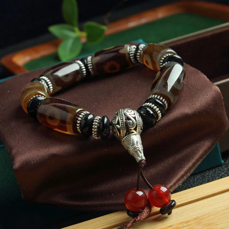 Distressed agate Tibet beads bracelet with three eye dzi design and polished stone beads