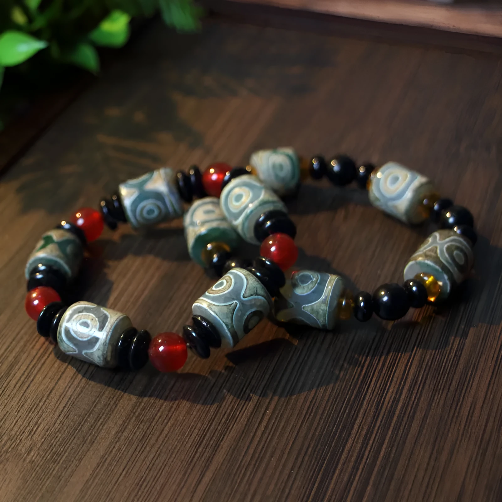 Distressed agate Tibet beads bracelet with three eye dzi design and polished stone beads