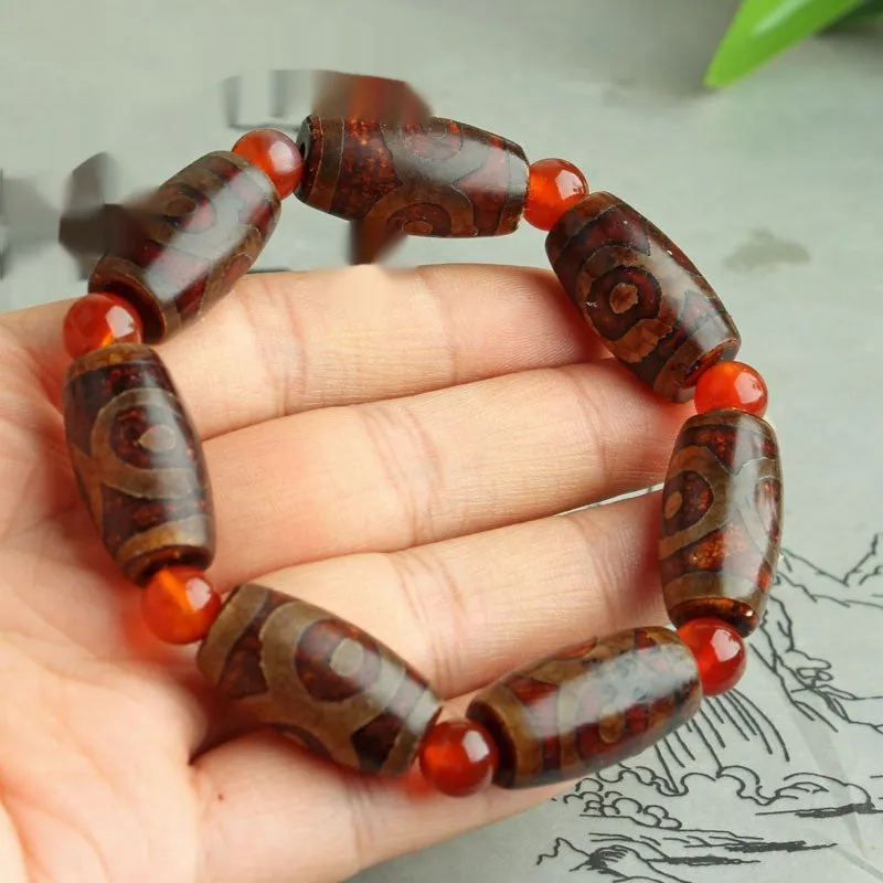 Distressed agate Tibet beads bracelet with three eye dzi design and polished stone beads