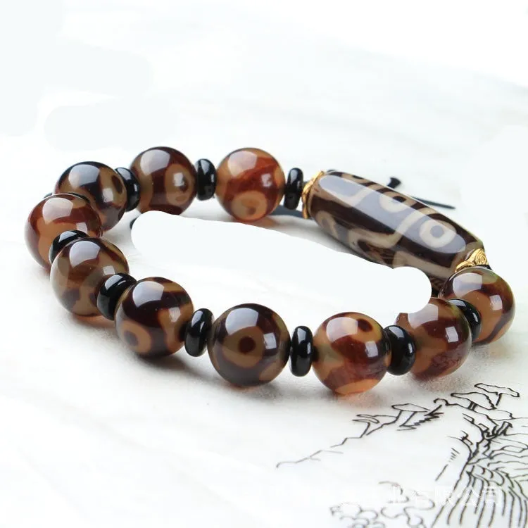 Distressed agate Tibet beads bracelet with three eye dzi design and polished stone beads