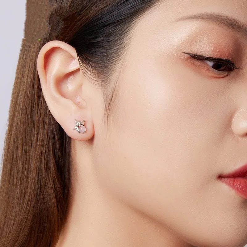 S925 sterling silver fox stud earrings with green jade inlay on white background
