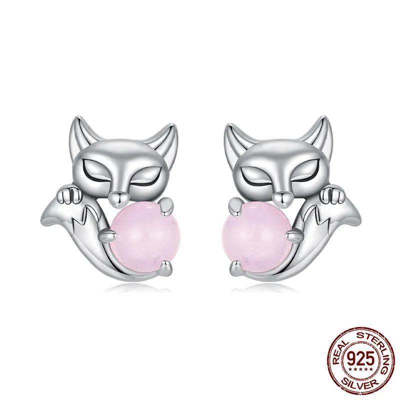 S925 sterling silver fox stud earrings with green jade inlay on white background