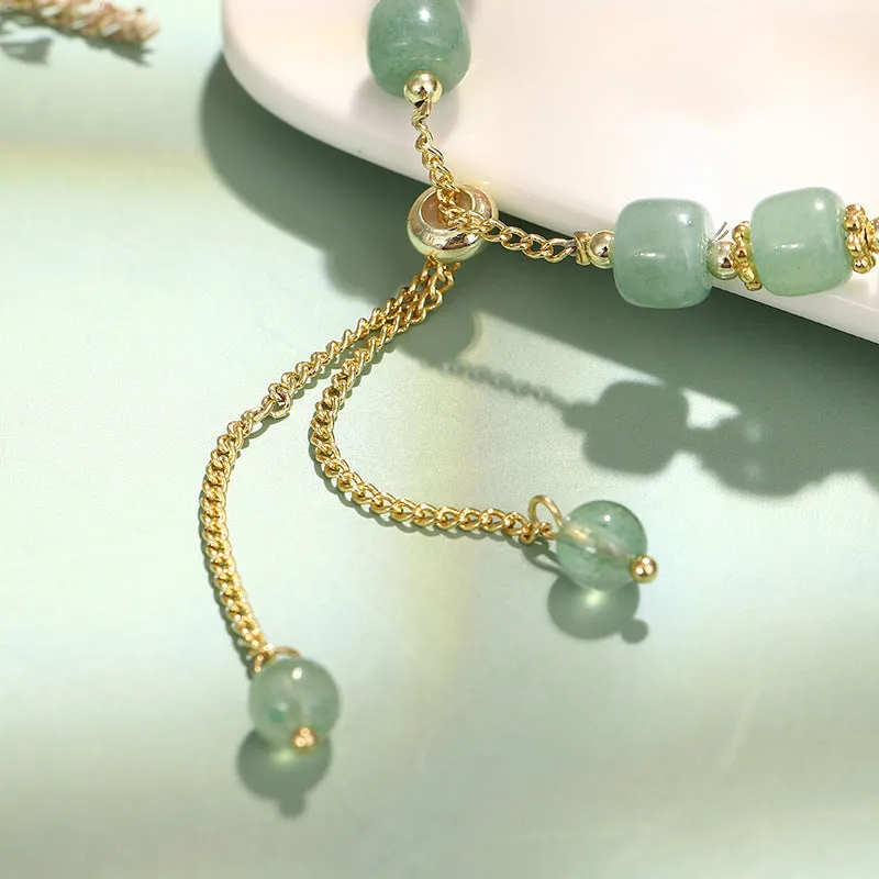 Women's rabbit design bracelet with green natural stones and copper gold accents