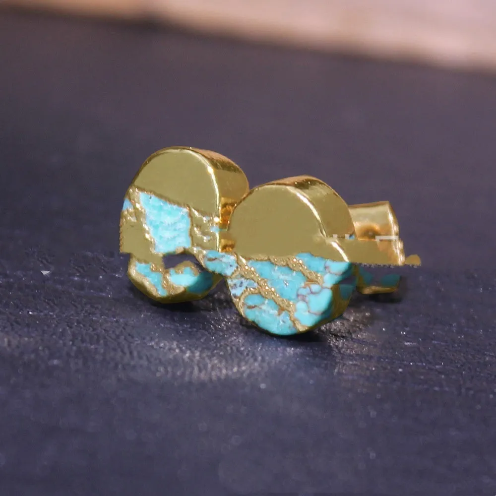 Close-up of handcrafted bohemian stud earrings with an irregular natural stone in colour ER1031 on a simple metal setting.