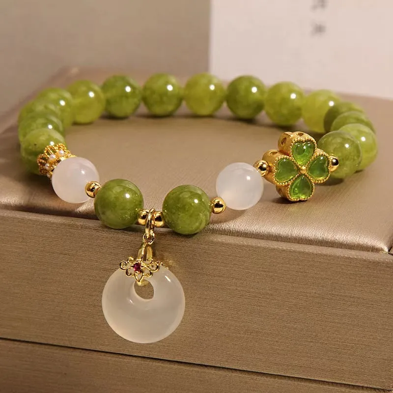 Women's green tourmaline four-leaf clover bracelet with silver electroplated finish and safety buckle clasp.