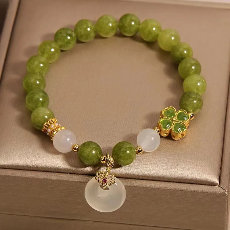 Women's green tourmaline four-leaf clover bracelet with silver electroplated finish and safety buckle clasp.