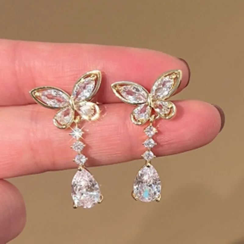 Bow-shaped zinc alloy stud earrings with electroplated platinum finish