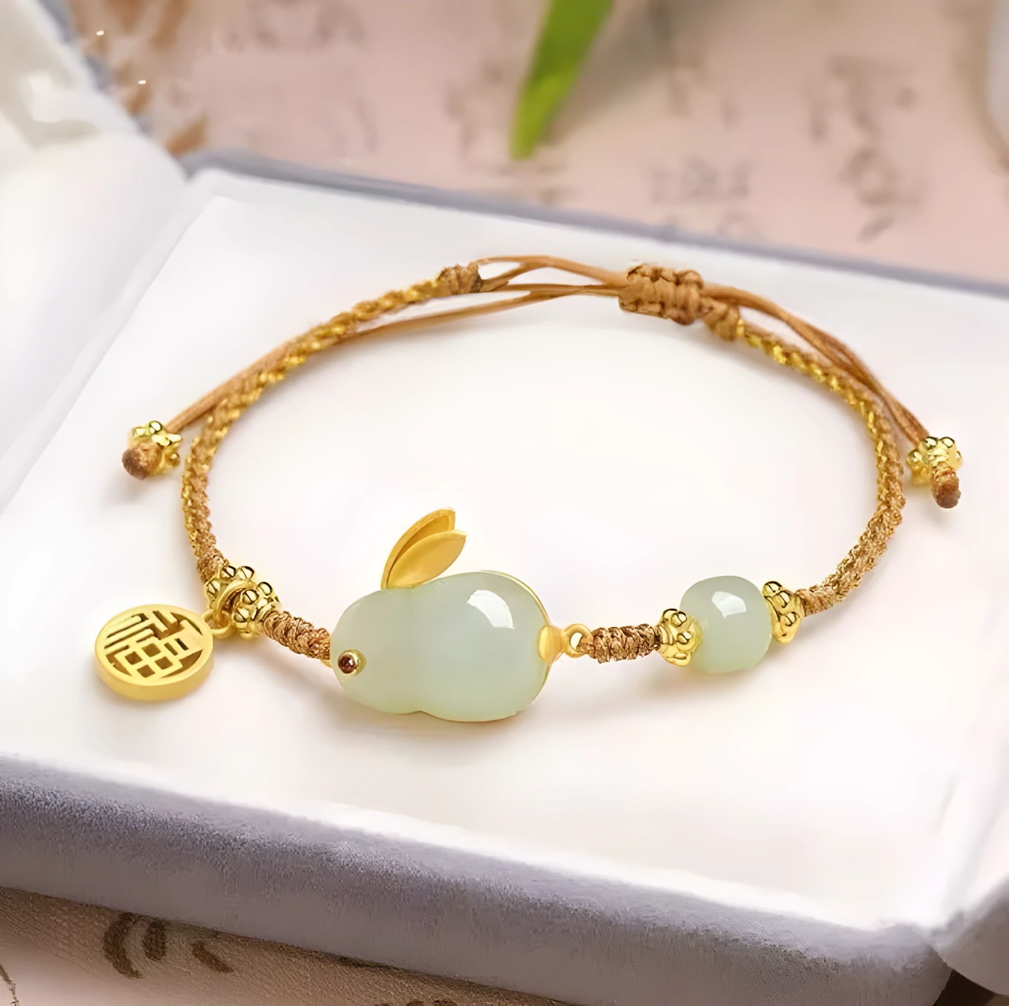 Yellow string bracelet with a geometric Hetian jade rabbit charm for women.