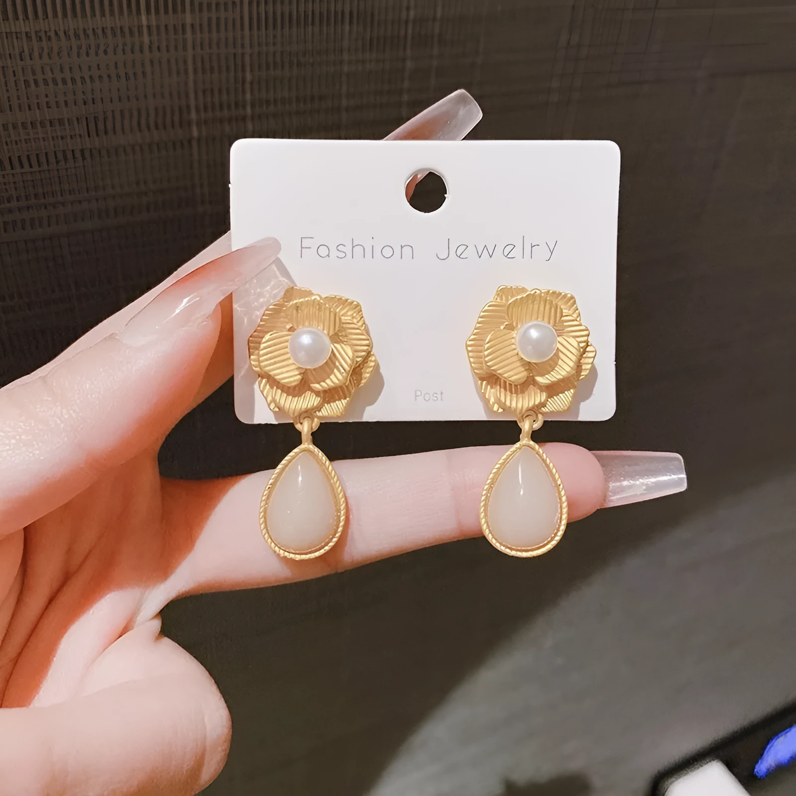 Gold-colour Hong Kong style floral stud earrings with opal stone and ice flower design on rose pearl motif.