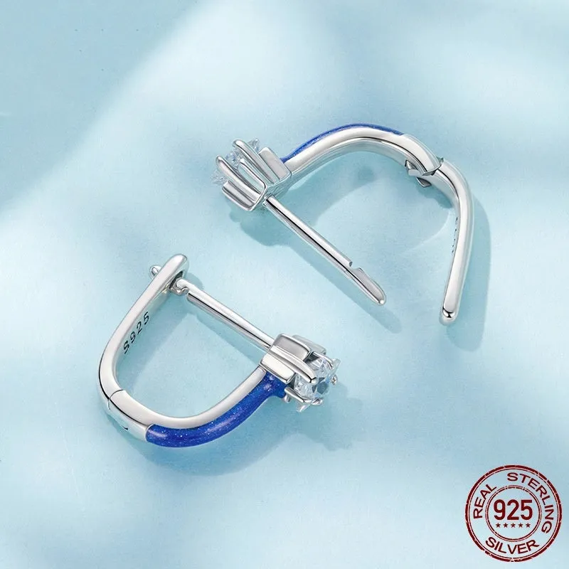 Pair of 925 sterling silver blue star pentagram ear clips with drip oil finish on white background