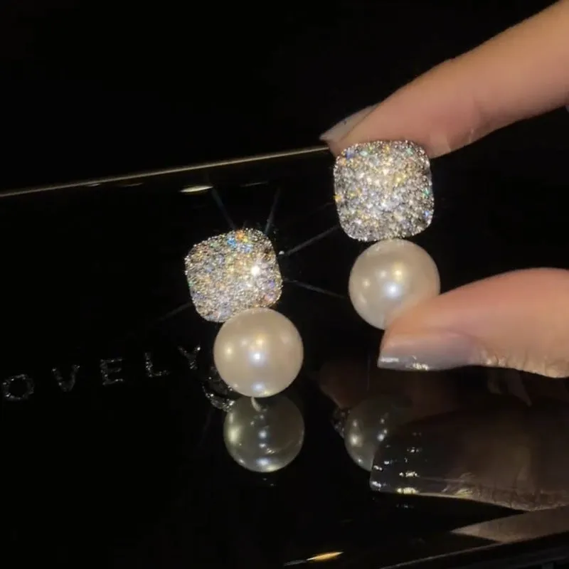 Micro inlaid zircon square pearl stud earrings with tassel detail in copper and imitation pearl, available in three colours: champagne, red, white.