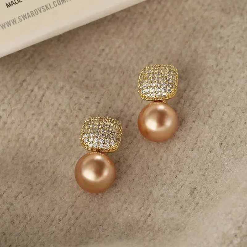 Micro inlaid zircon square pearl stud earrings with tassel detail in copper and imitation pearl, available in three colours: champagne, red, white.