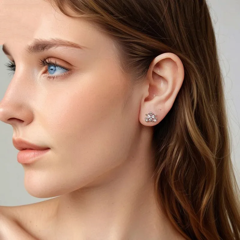 Pair of 925 silver retro pumpkin car stud earrings with romantic French design against a neutral background