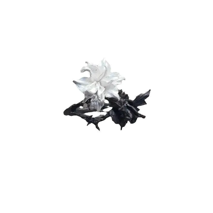 Open mouth copper ring with white and black colour separation and lily motif on a plain background