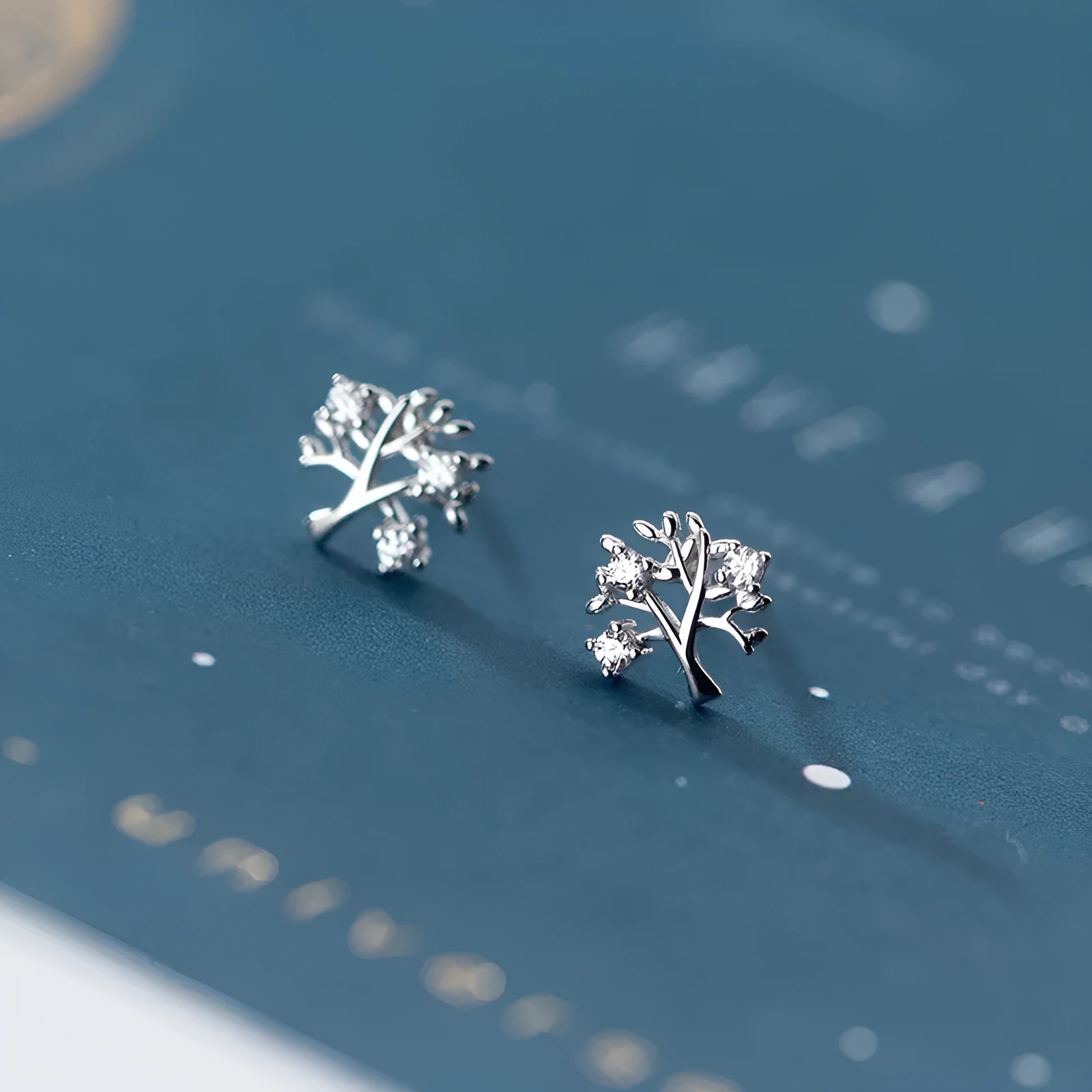 White gold coloured copper stud earrings with cute little tree design electroplated finish for women