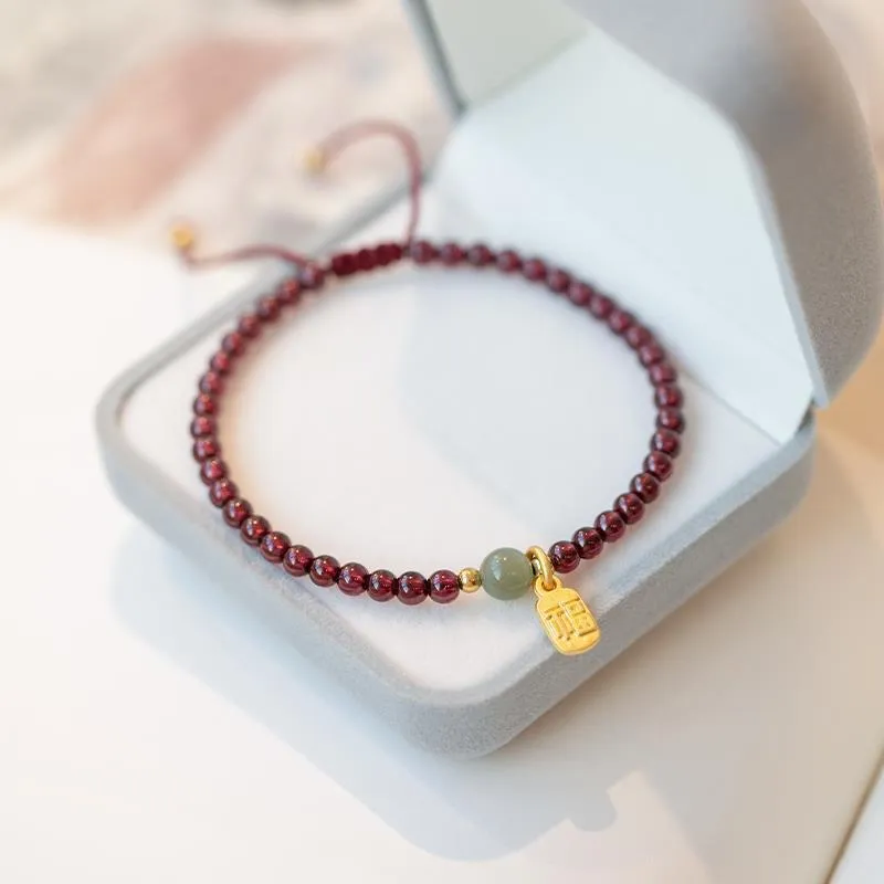 Red rope bracelet with strawberry quartz and garnet beads, hand-woven adjustable design