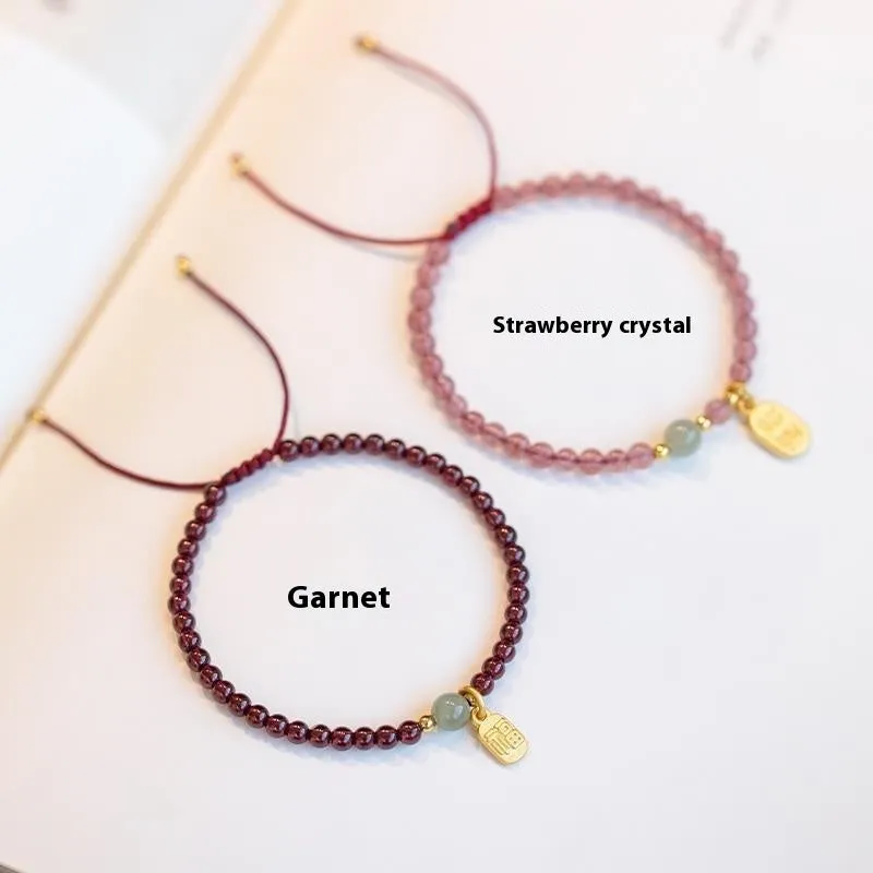 Red rope bracelet with strawberry quartz and garnet beads, hand-woven adjustable design