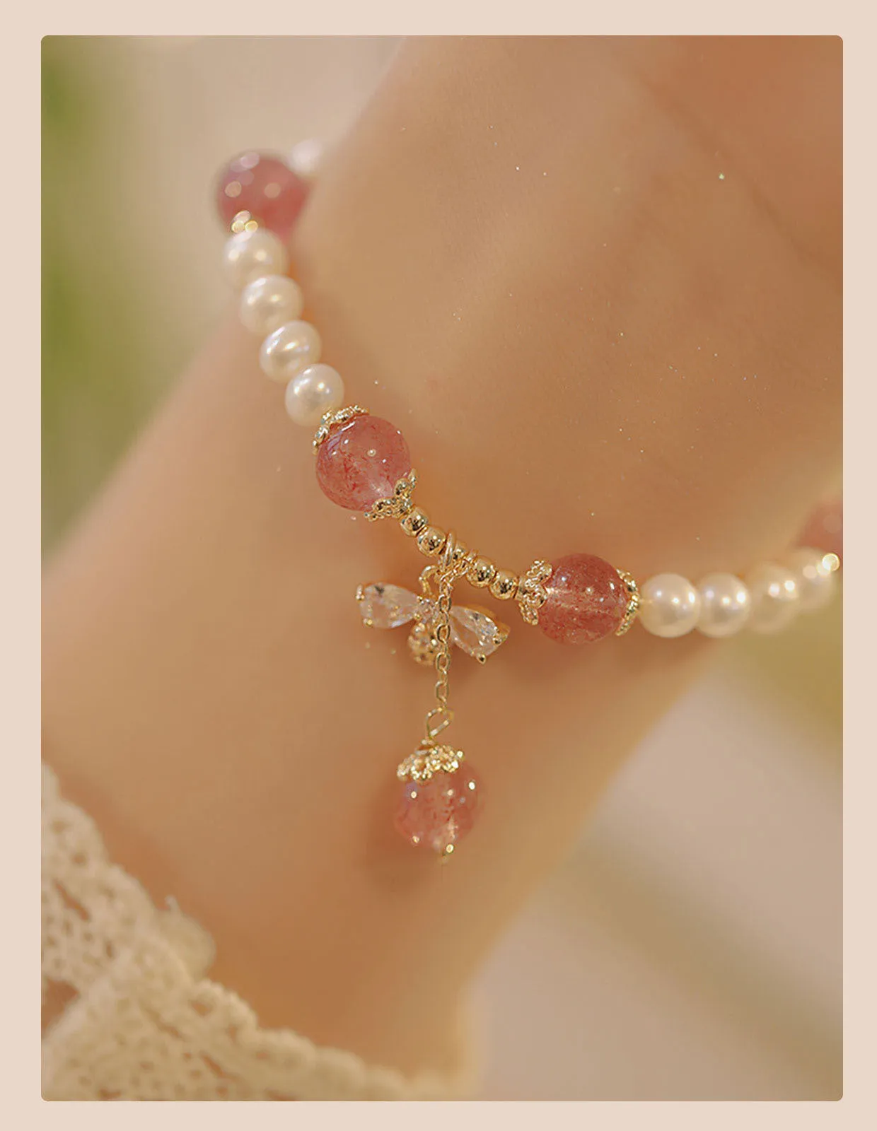 Handmade women's strawberry quartz crystal bracelet with a decorative bow clasp.
